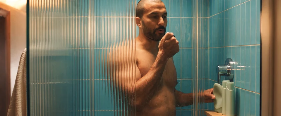 A man uses Interface in the shower, in a frame from the teaser
